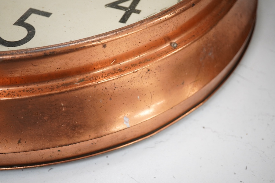 A copper Magneta Electric wall clock, with Arabic dial 53cm in diameter. Condition - fair/good, untested